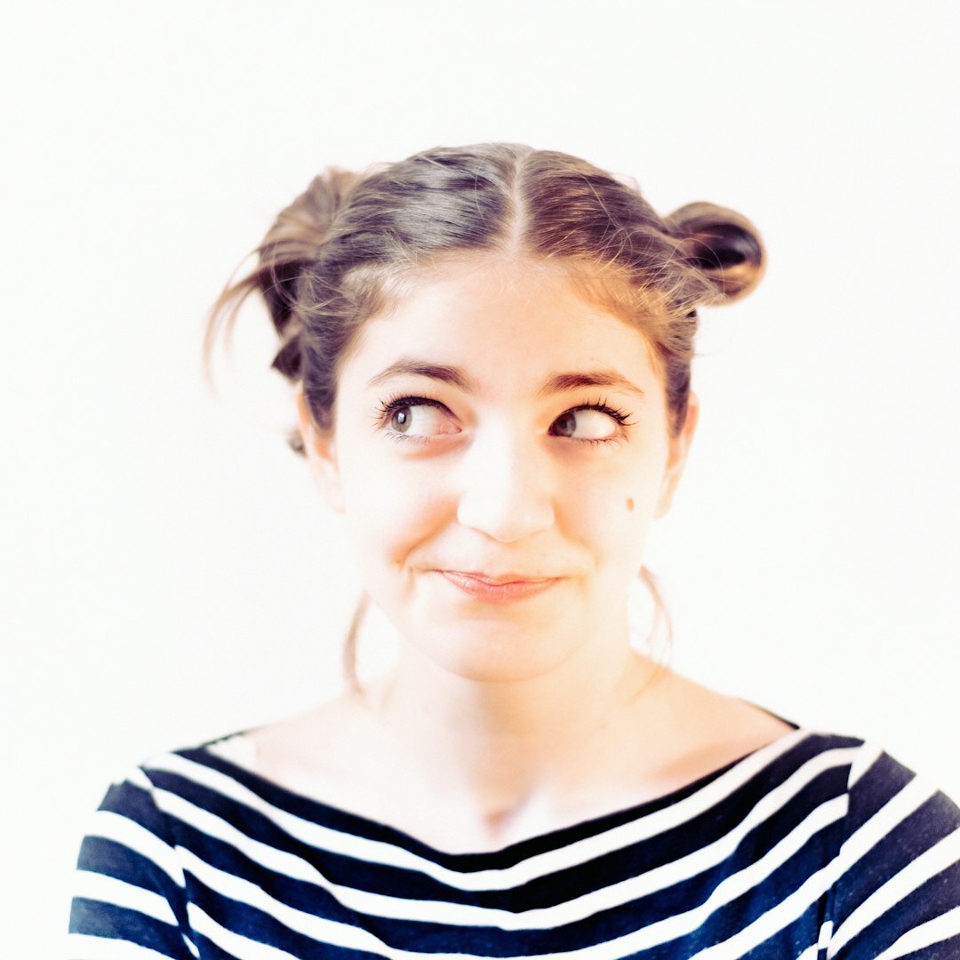 Studio portrait of a woman field reporting coach smiling