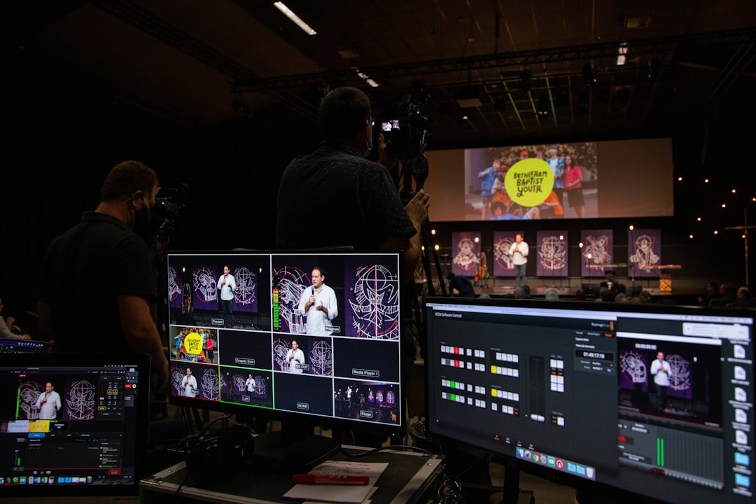Broadcast control room with monitors showing multiple live camera feeds